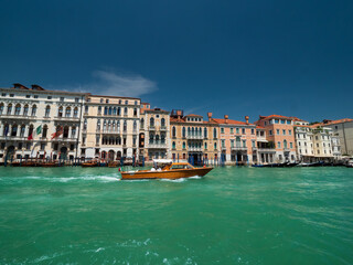 Venezia green water Lagoon and boat life embedded with mediterranean Architecture 