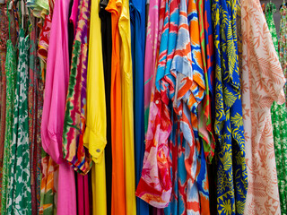 different dresses and patterned fabric shop fashionable background clothing store clothes in shopping center boutique