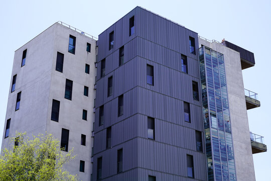 High Modern White Line Facade Grey Building With Balcony In City