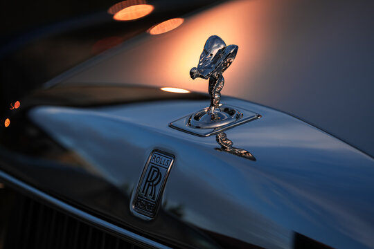 The Spirit of Ecstasy Rolls-Royce automotive icon on the hood of a brand new Phantom model in amazing sunset light. Details of this premium luxury car. Romania, 2022.