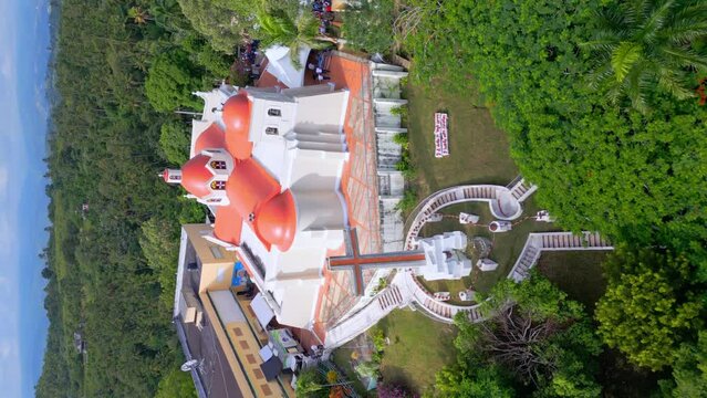Nuestra Señora de las Mercedes sanctuary, Santo Cerro. La Vega in Dominican Republic. Aerial orbiting. Vertical format