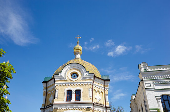 Kiev, Ukraine. Church building architecture, Pechersk Lavra monastery with golden cupol against blue sky background