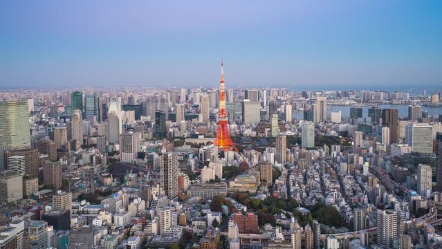 4k Time lapse Day to night of Tokyo tower with buildings in Tokyo City, Japan.