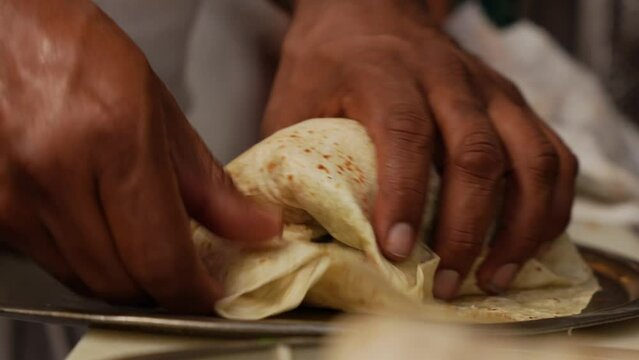 Chef Making A Shrimp Burrito - Mexican-style Burrito In The Restaurant. - close up