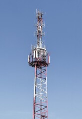 Technology on the top of the telecommunication GSM (5G,4G) tower with copy space.Cellular phone antennas on a building roof.Telecommunication mast television antennas.Development communication system