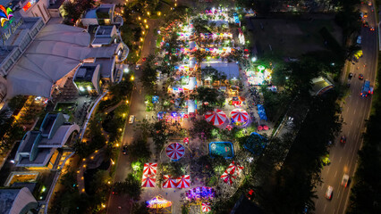 Aerial view of the summer market culinary festival in Bekasi, people eat a variety of national dishes, cultural diversity, city culinary appeal, senggol market. 