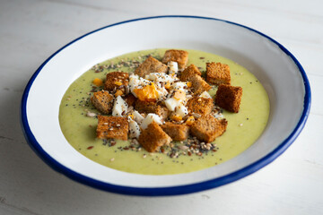 Artichoke cream with bread croutons and boiled egg. Typical Spanish vegan tapas.
