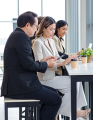 Millennial Asian successful professional male businessman female businesswoman employee in formal...