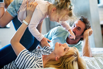 Happy family having fun time at home. People love child home concept.