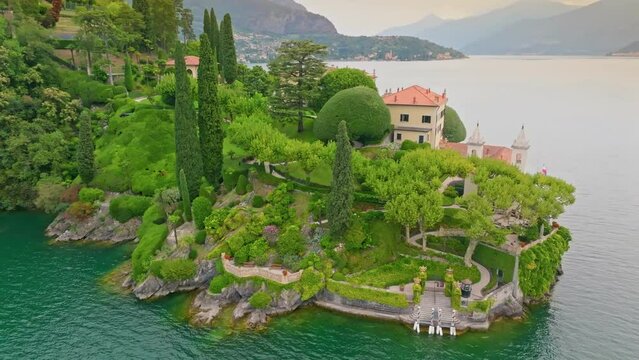 Great aerial view of Villa del Balbianello, Lake Como, Italy. Beautiful garden and villa on the shores. Tremezzina, Como Lake, Lombardy, Italy. 4K UHD