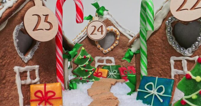 Christmas gingerbread village with cookies, candies and snow.