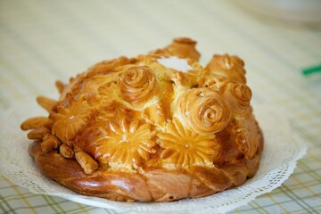 Fresh baked round loaf bread. The concept of a good-natured greeting in the culture of many peoples.