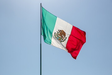 Mexican flag isolated on blue sky