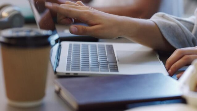 Startup business, graphic designer hands with laptop in a cafe workspace for productivity, digital marketing or website ux ui. People collaboration, planning review of social media seo data strategy