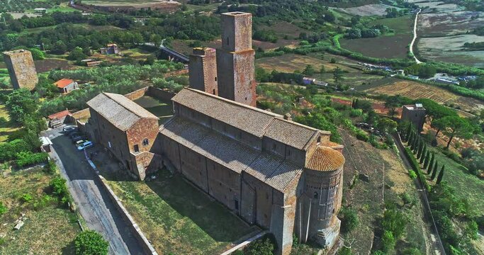 Aerial view of the church of San Pietro in Tuscania. Place of Catholic worship in Tuscania which stands on the hill of the same name, site of the Etruscan acropolis. Circular movement around the Basil