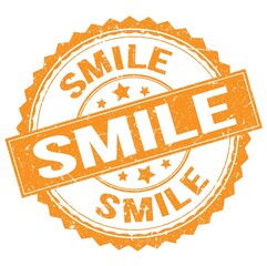 Obraz premium SMILE text on orange round stamp sign