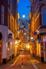 Fototapeta na wymiar Narrow Night Street in Downtown Amsterdam