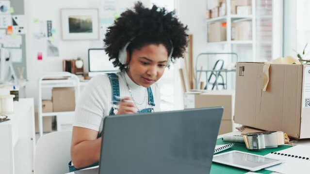Black woman, laptop and notebook for ecommerce in office, home or studio to design. Woman, logistics and orders on website to help delivery online, with computer or pc at desk, for shipping product