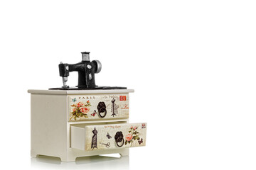 jewelry box with decorative sewing machine on a white background