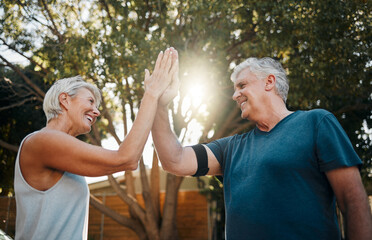 Fitness senior couple high five for support, teamwork and exercise motivation with sunshine,...