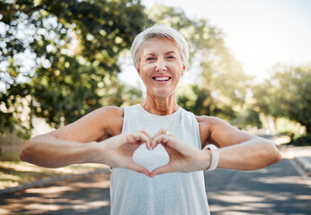 Fitness, happy and heart hands of old woman in nature after running for health, wellness and...