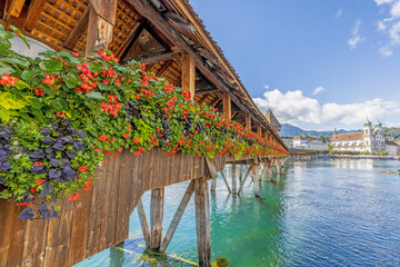 View along the flower-covered Chapel Bridge in Lucerne