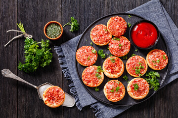 mini pizzas with ham and pecorino cheese, top view
