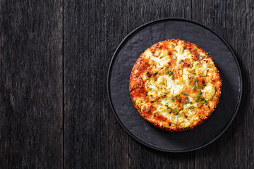 Cauliflower Cake with cheese, basil, top view