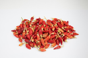 Small red dried chili peppers isolated on white Background