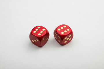 red dice with golden numbers isolated on white background.