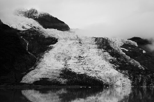 glacier in alaska in black and white photography 24-70mm lens with canon eos r5 during autumn time in united states art with cloudy and foggy wilderness