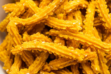 Bhajni chakli sticks or crunchy murukku snack made using diwali festival, favourite munching food