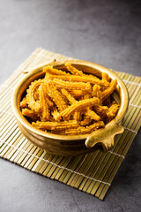 Bhajni chakli sticks or crunchy murukku snack made using diwali festival, favourite munching food