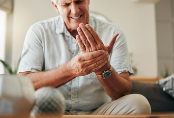 Senior man, hands and wrist joint pain in living room home from carpal tunnel, osteoporosis and...