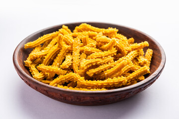 Bhajni chakli sticks or crunchy murukku snack made using diwali festival, favourite munching food