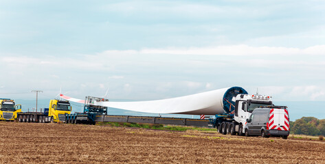 Wind turbine under construction. Blade for wind turbines close up. Special transport of a blade for...