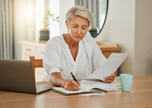 Senior woman with notebook writing budget plan for retirement and review finance documents. Elderly person with pen and paperwork planning financial bank payment, savings and doing home accounting