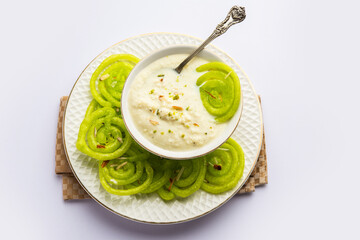 Rabdi Jalebi - Green jilebi or imarati with Rabri made from condensing milk, Indian dessert