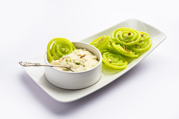 Rabdi Jalebi - Green jilebi or imarati with Rabri made from condensing milk, Indian dessert