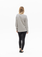 Striped sweater. Woman in lightweight casual oversize sweatshirt and black pants on white background. Rear view