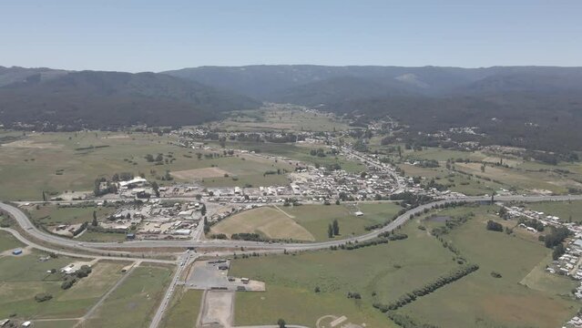 Aerial push in shot of a city in the middle of the praires in Chile