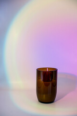 Soy Wax Candle in Amber Glass on pink gradient background.