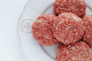 Homemade hamburger patty on dish with copy space