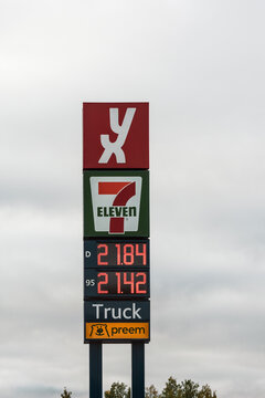 Yx 7 eleven gas prices truck stop and preem text on signpost on the road in norway