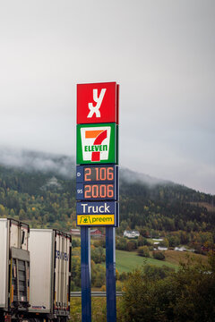 Yx 7 eleven gas prices truck stop and preem text on signpost on the road in norway