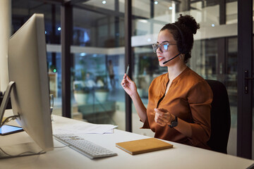 Call center, customer support and insurance agent consulting at night in a office at a contact help desk. Sales, telemarketing and employee working hard in helping, talking and listening via headset - obrazy, fototapety, plakaty