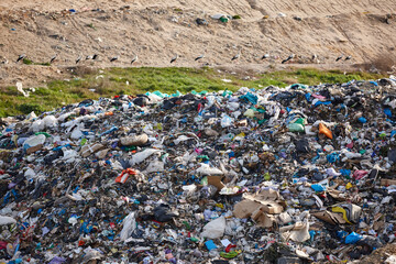 Open air garbage dump. Plastic waste pollution. Global warming. Consumerism