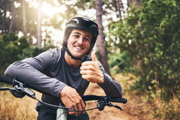 Thumbs up man rider on mountain bicycle happy riding or training for fitness, wellness and health exercise outdoor. Cycling, active and workout sports athlete smile for success, motivation and cardio