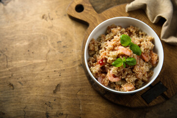 Healthy quinoa bowl with shrimps and basil