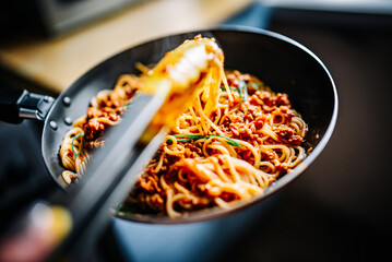 Cooked Italian spaghetti bolognese sauce in the pan on kitchen